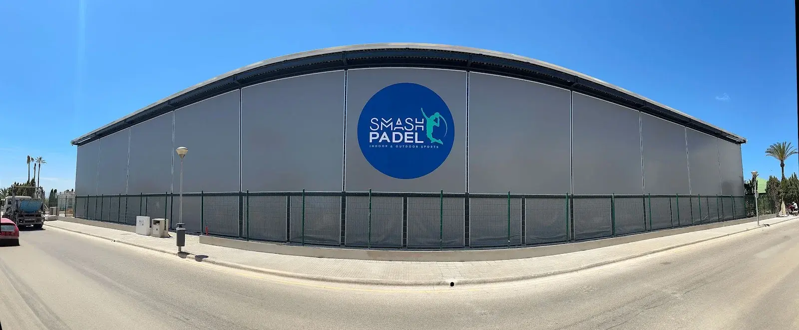 The gesture of a padel smash turned into a logotype with its own energy.