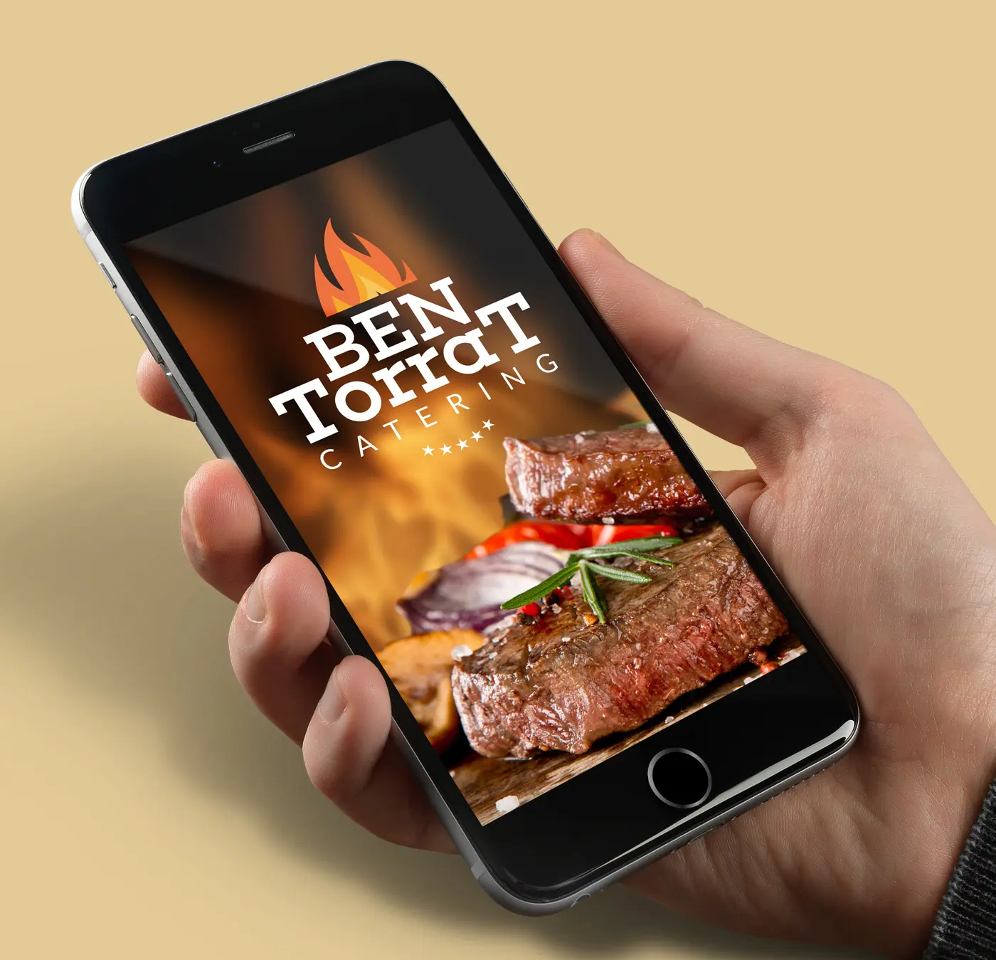 Pantalla de móvil con el logotipo de llama de Ben Torrat Catering