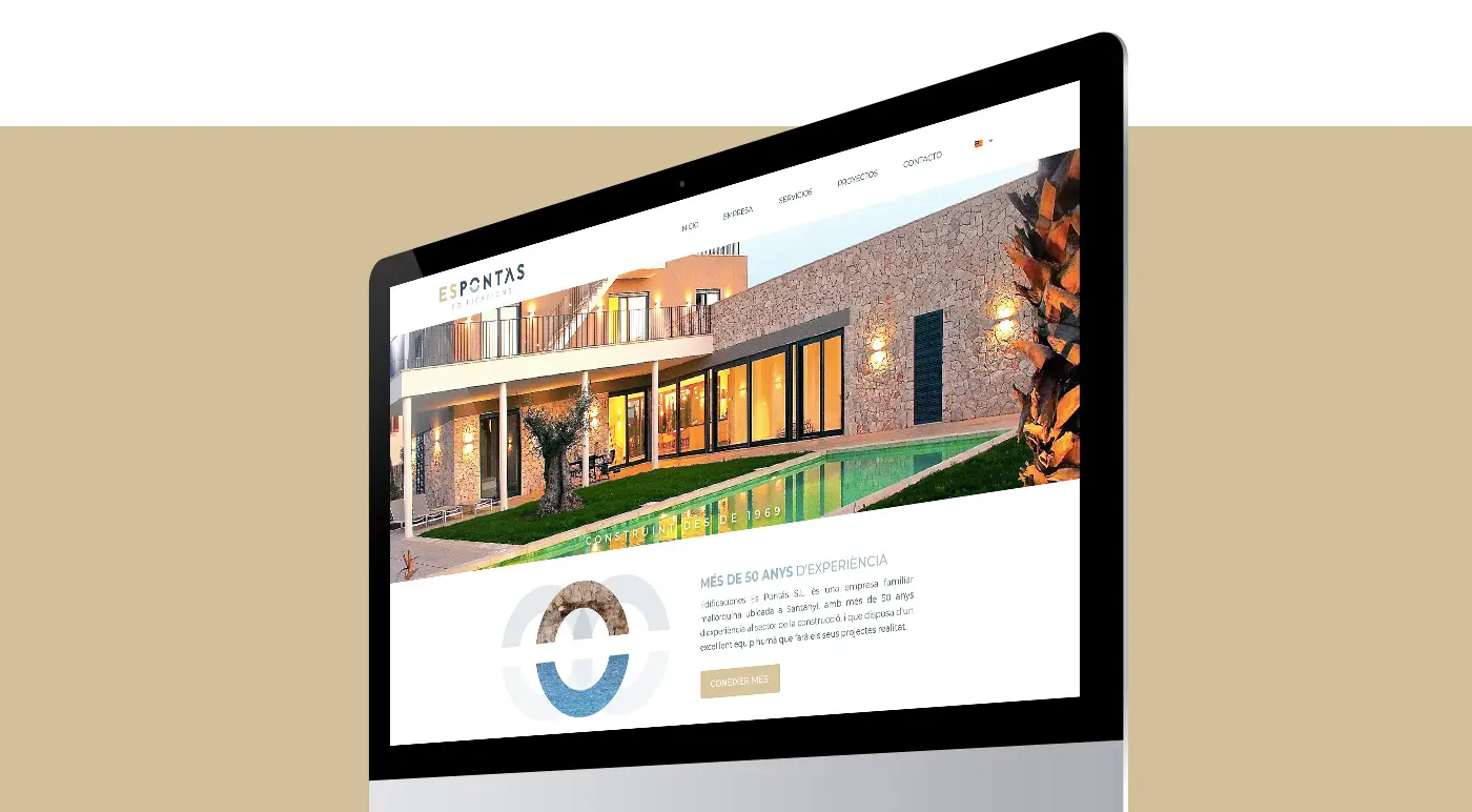 Mockup of the Es Pontàs website on an iMac with a night-time photo of the house