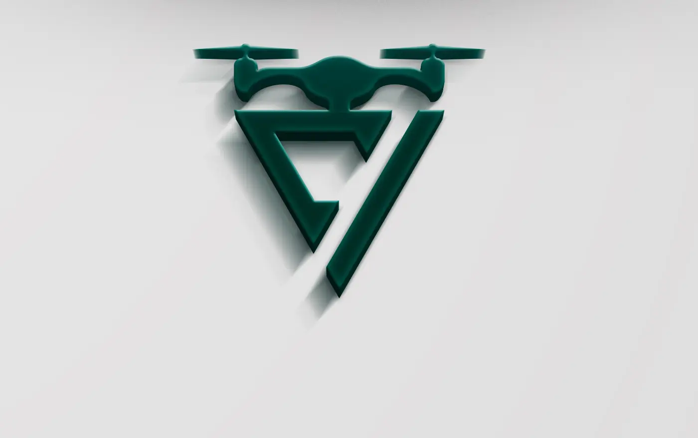 Isotipo del dron en relieve verde aplicado sobre superficie blanca