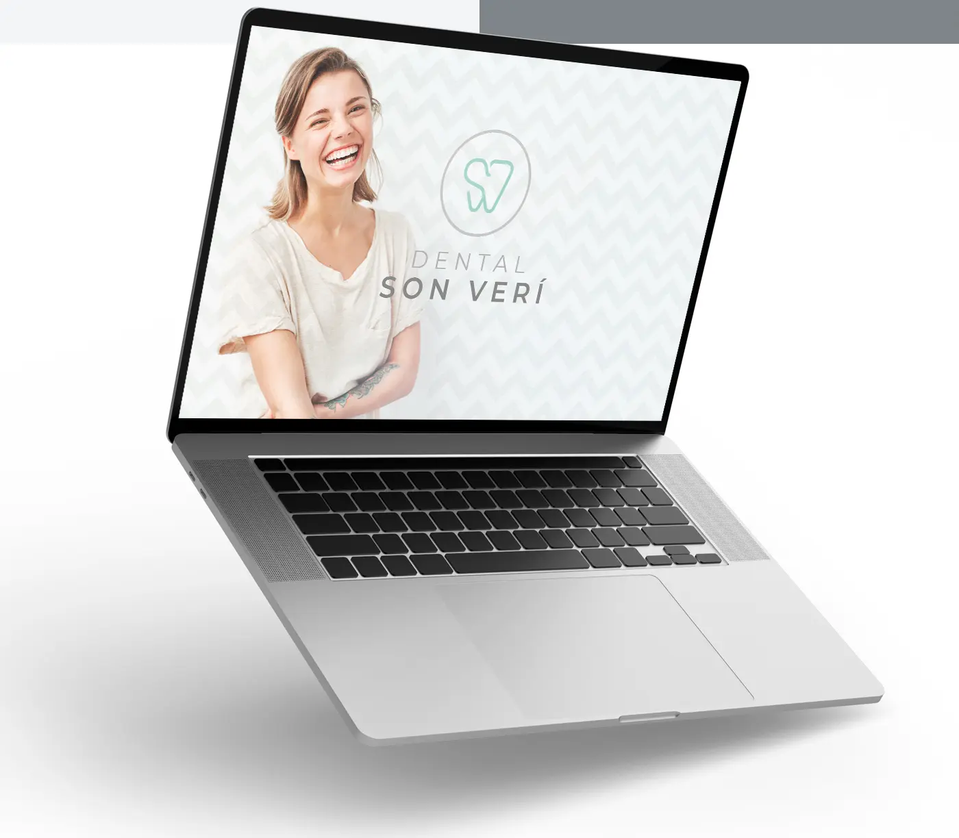 Dental Son Verí website on a laptop with a photo of a smiling patient