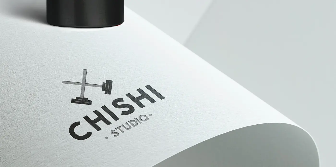 Detail of the logo embossed on a rolled sheet of paper