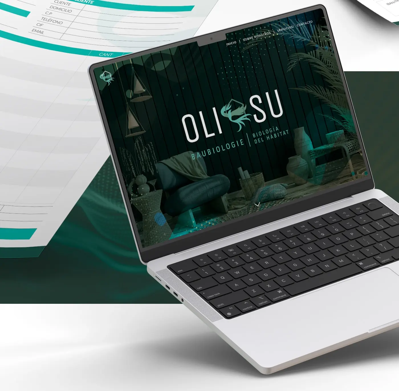 Página web de Oli-Su mostrada en un portátil junto a documentación impresa