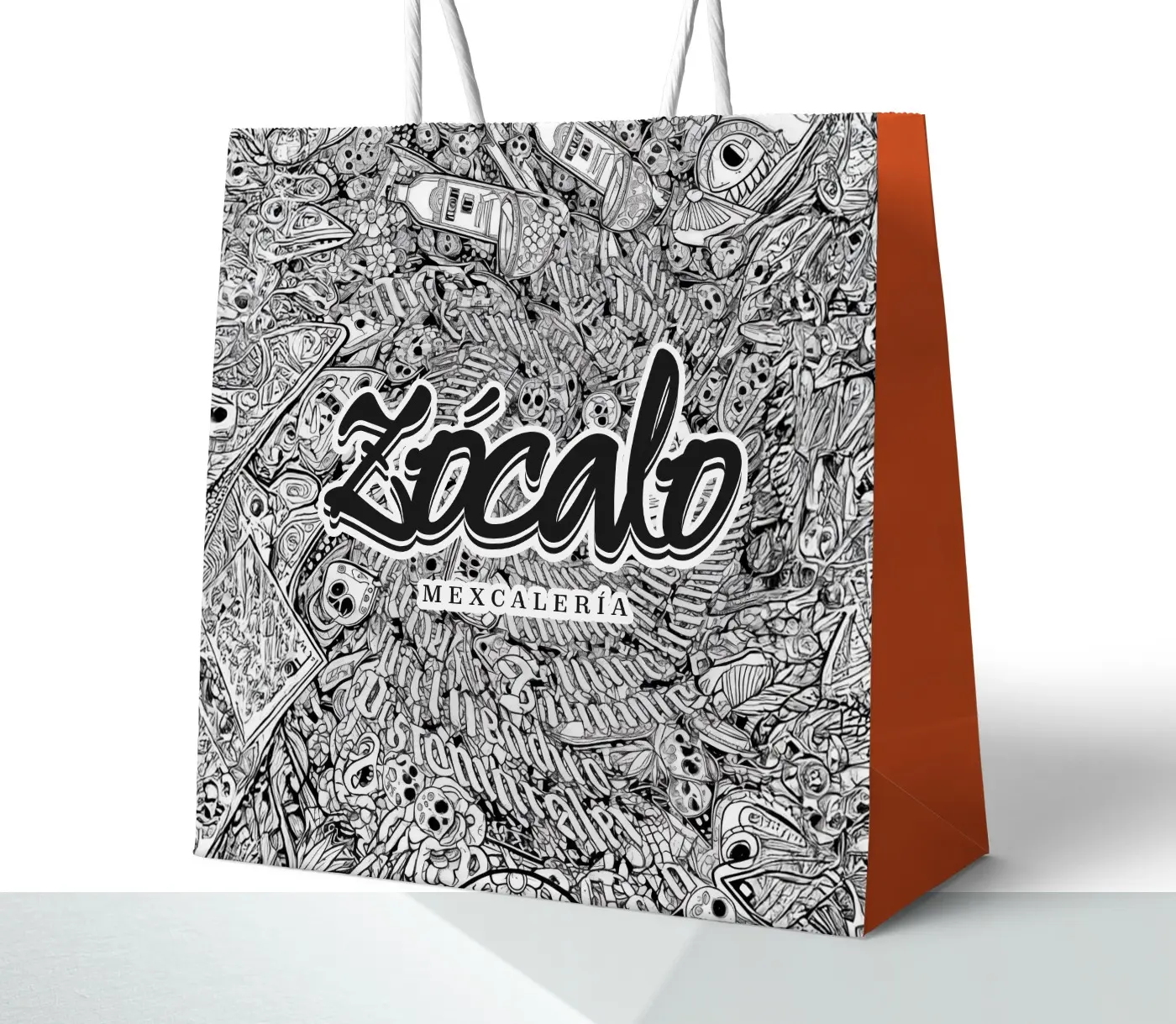 Mockup de bossa de paper amb il·lustració de calaveres mexicanes i el logotip en negre