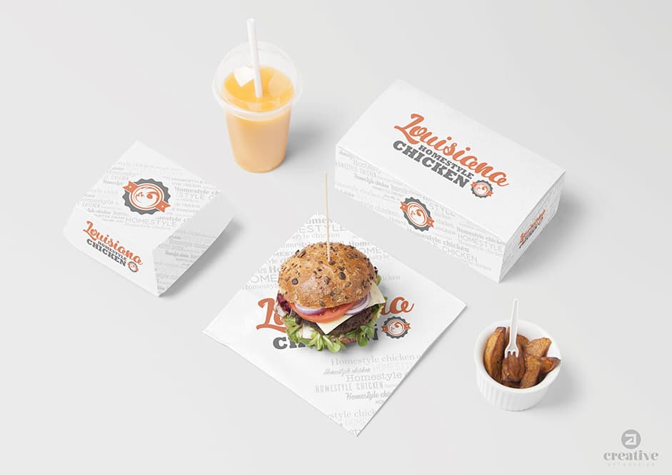 Packaging per emportar amb hamburguesa, patates fregides i refresc sobre la taula