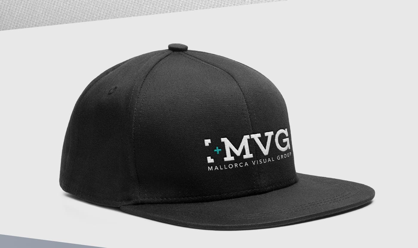 Black cap with the MVG logo embroidered in white and turquoise