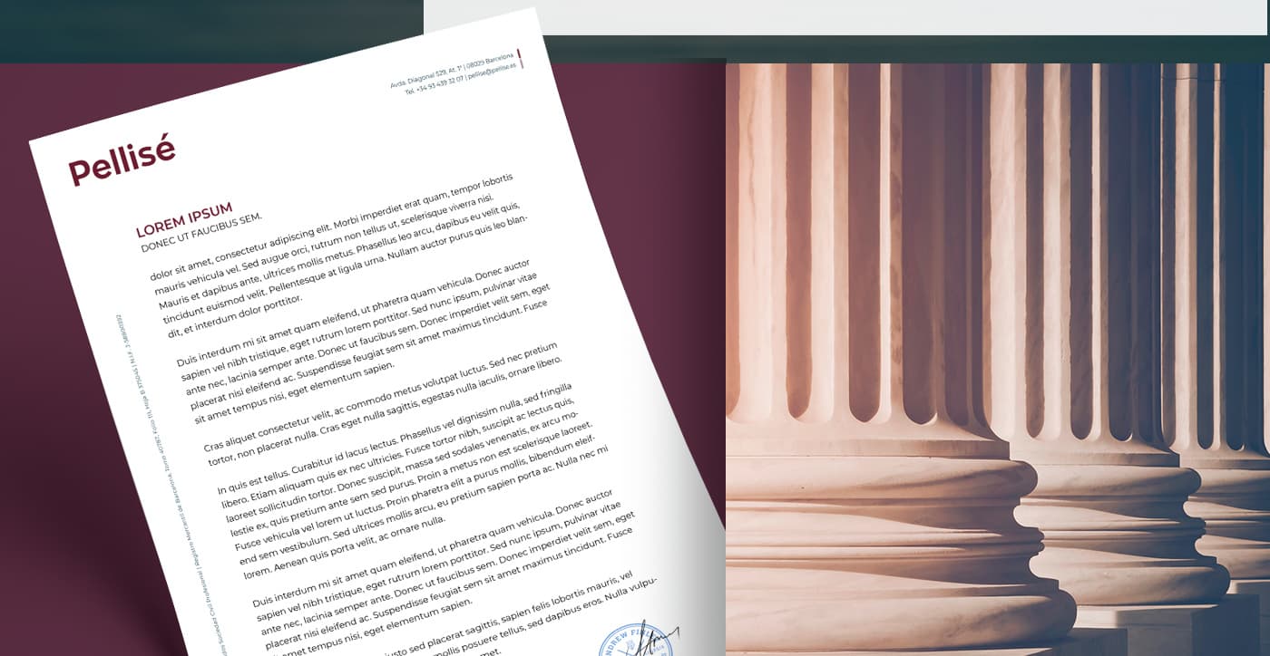 Papelería corporativa con membrete junto a una fotografía de columnas clásicas