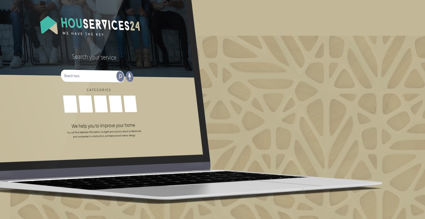 Mockup del logotip aplicat a la home de la web en un portàtil