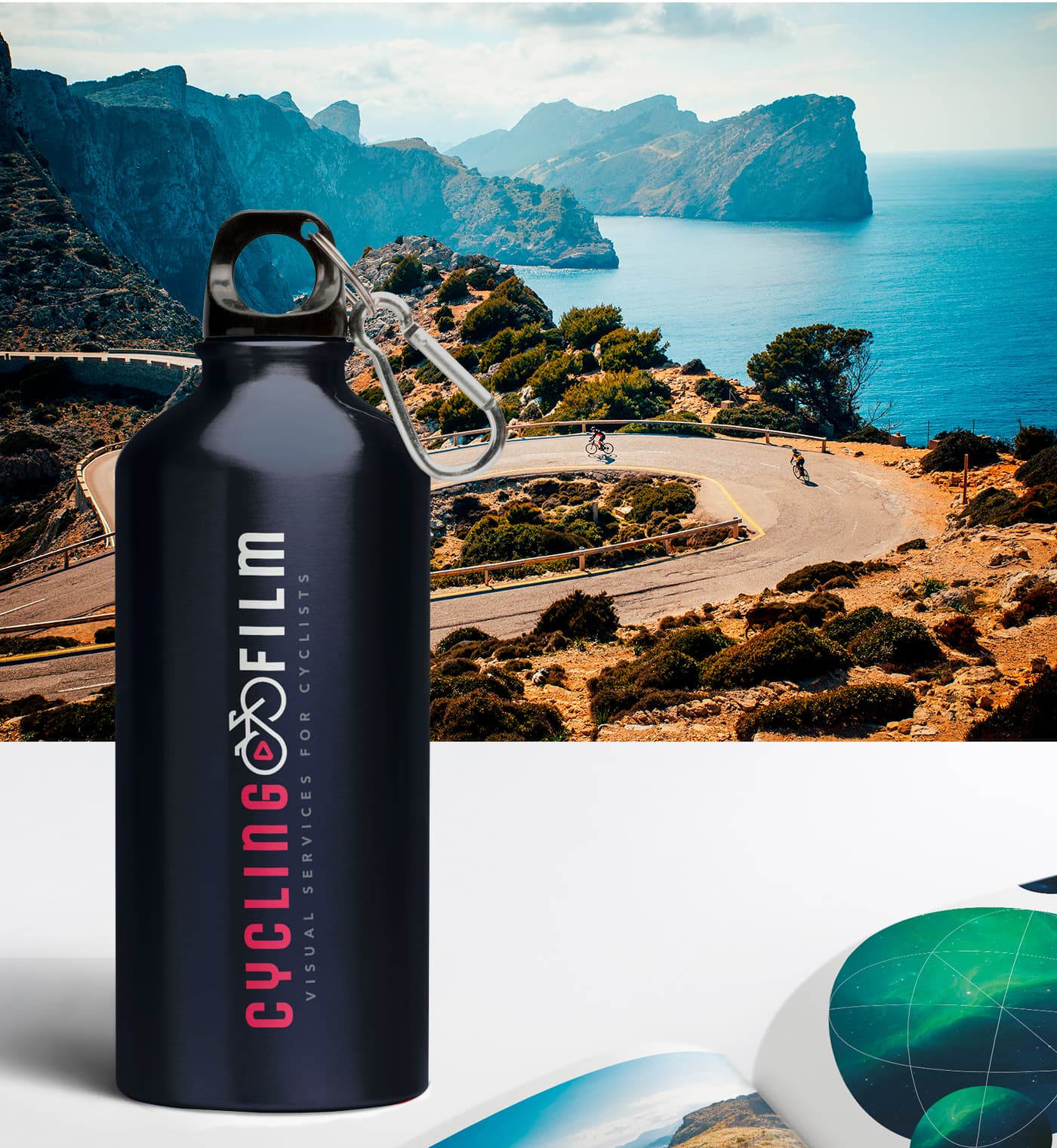 Personalised metal water bottle with the logo, next to a mountain pass