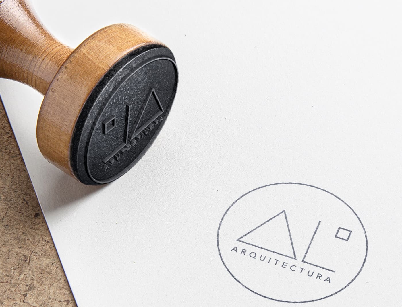 Mockup of the AL Cuadrado Arquitectura seal stamped with a wooden stamp