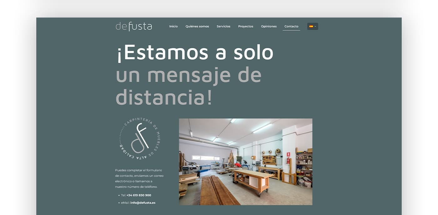 Página de contacto con el sello de calidad de Defusta y foto del taller de carpintería