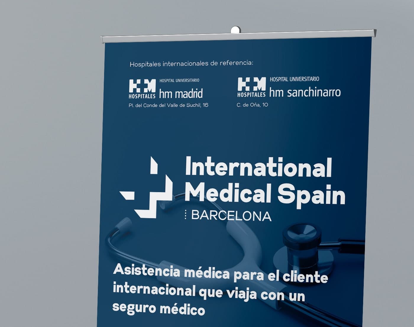 Advertising roll-up with the logo, reference hospitals hm Madrid and hm Sanchinarro, and a stethoscope