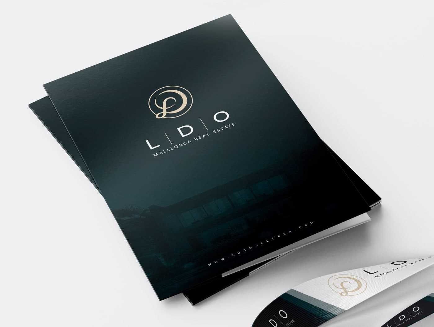 Corporate folders in dark teal green with the gold LDO monogram
