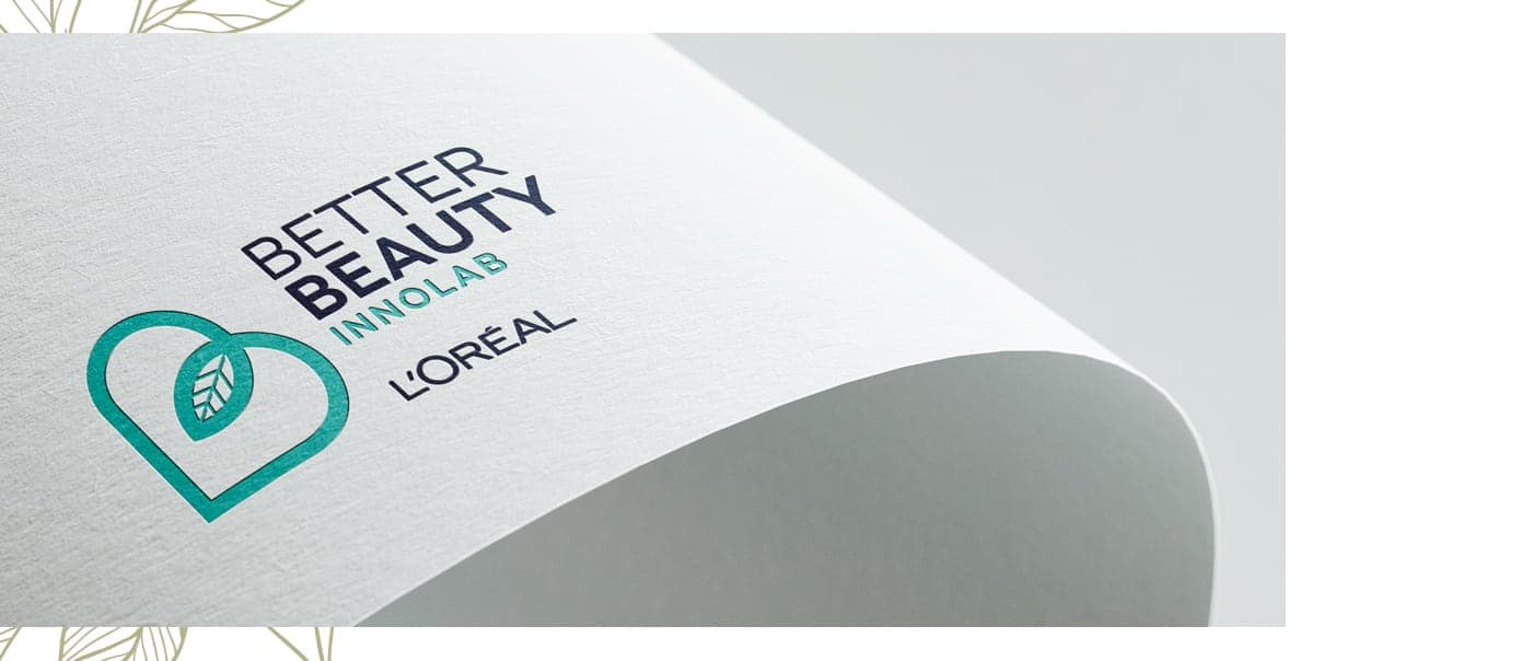 Logotype printed in ink on a curved sheet of paper