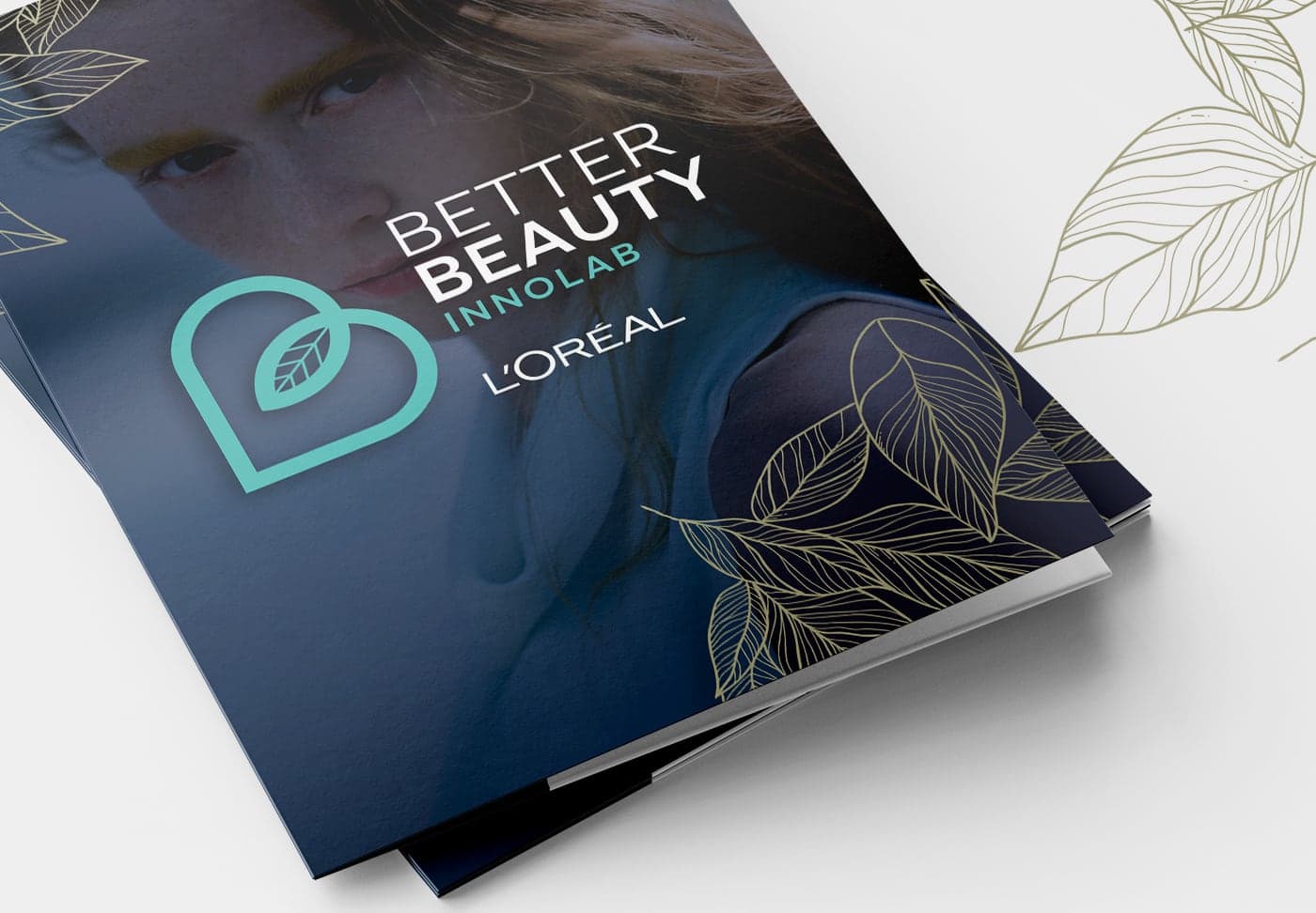 Dossier cover with the logotype and a portrait of a model in blue