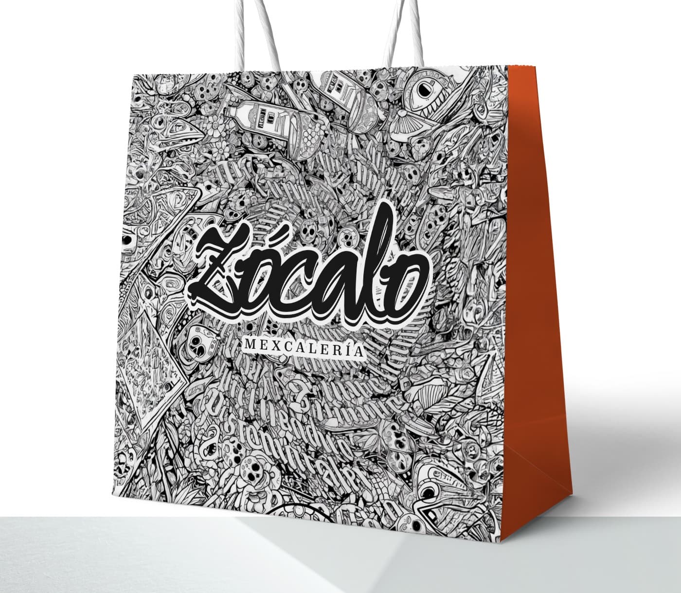 Mockup de bossa de paper amb il·lustració de calaveres mexicanes i el logotip en negre