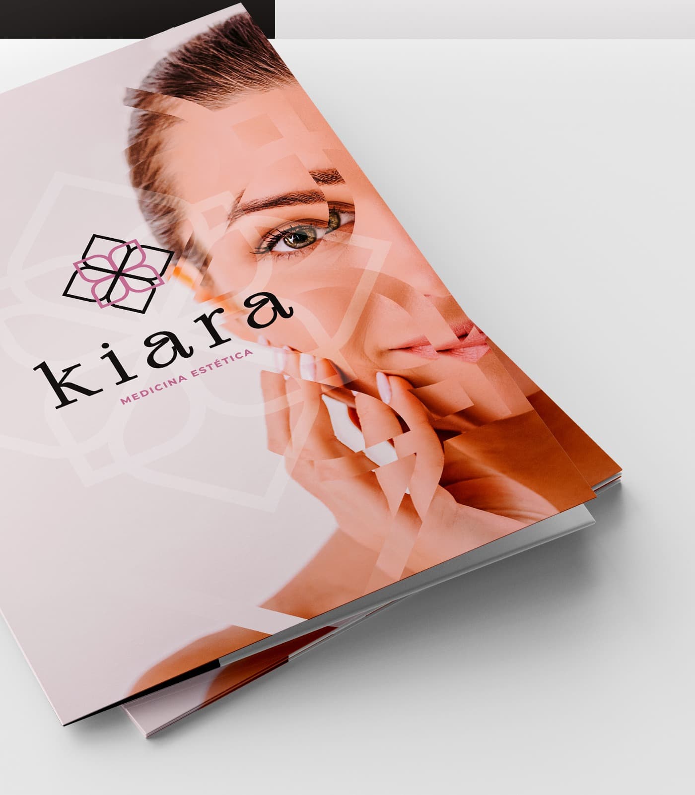 Mockup of the corporate dossier with a woman's face geometrically fragmented