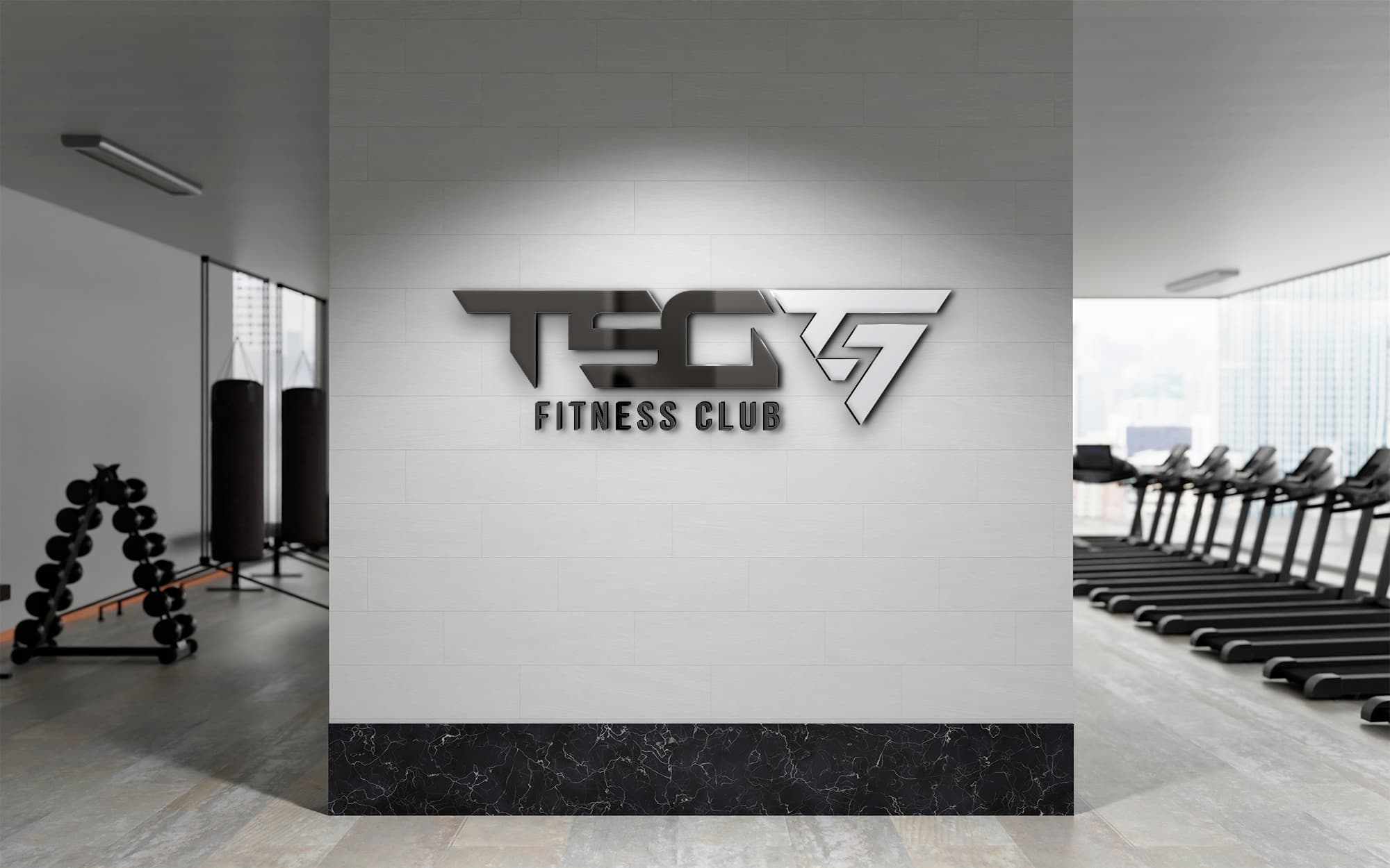 Metallic TSG Fitness Club logotype applied on the gym's reception wall