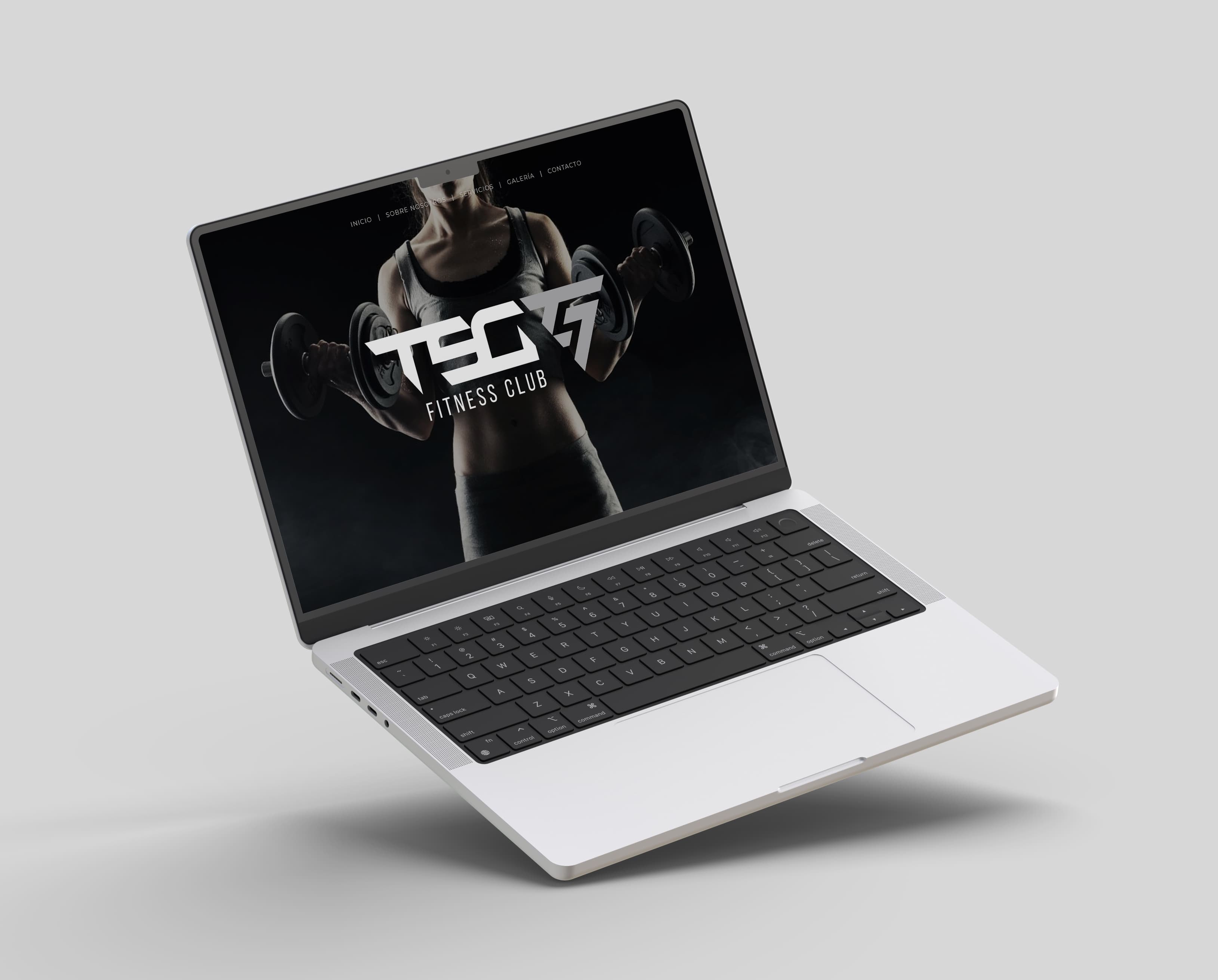 Laptop with the website homepage and a photograph of an athlete with dumbbells